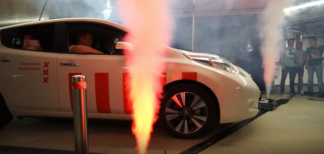 Vehicle unveiling with illuminated CO₂ smoke effects