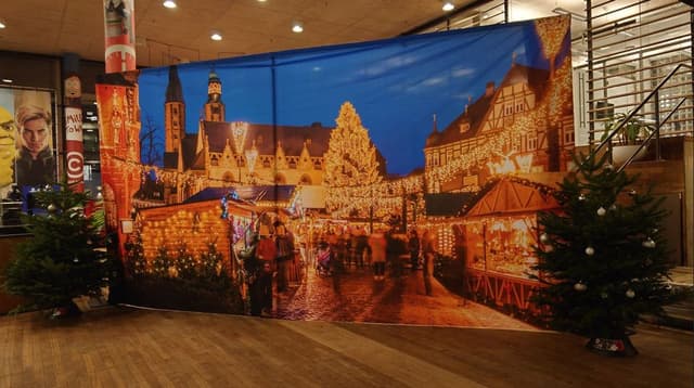 Winter market setting with wooden chalets, warm lighting and Christmas trees