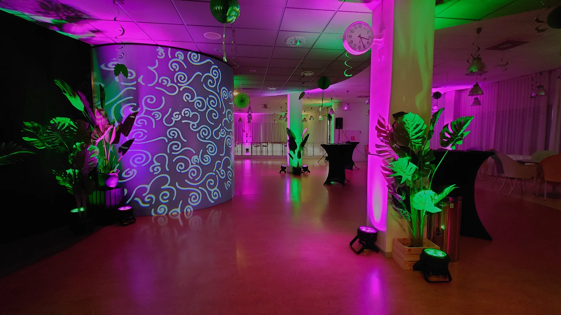 Restaurant with light projection, plants and atmospheric lighting