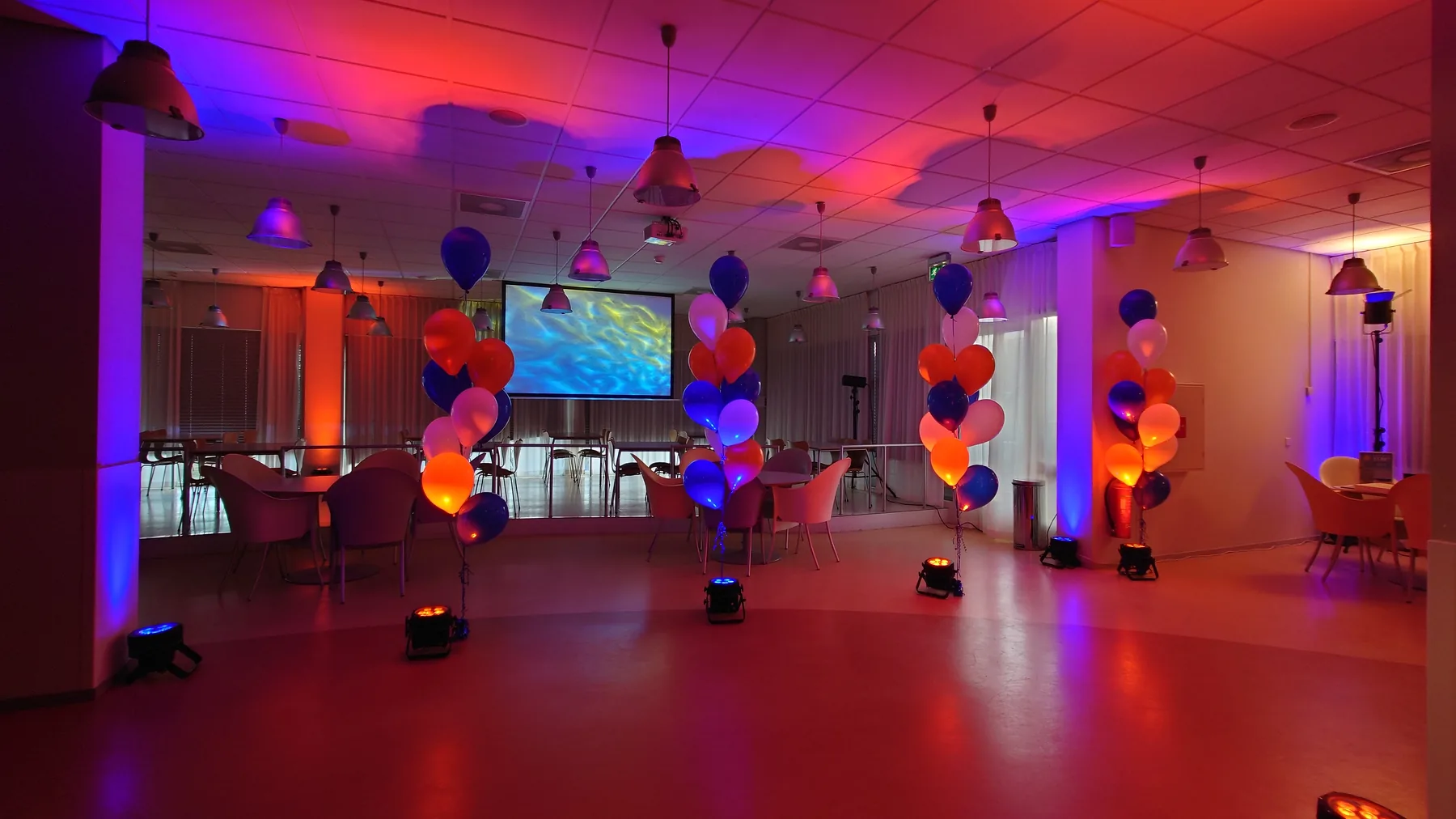 New Year reception arrangement with orange-blue light and balloons