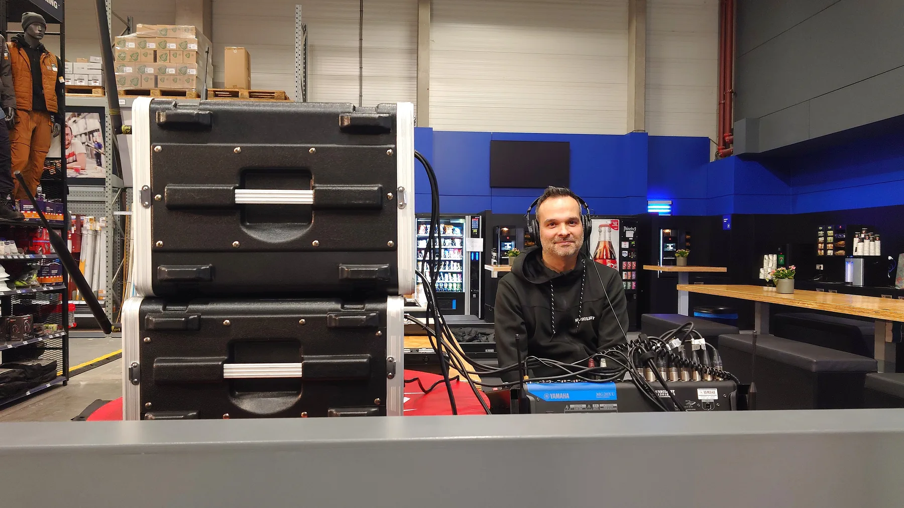 Audio technician at the mixing desk inside the venue