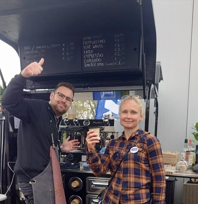 Barista and guest at the coffee cart