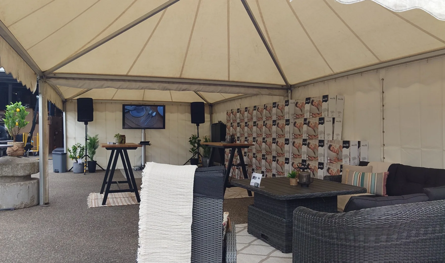 Marquee with presentation screen, speakers and seating area